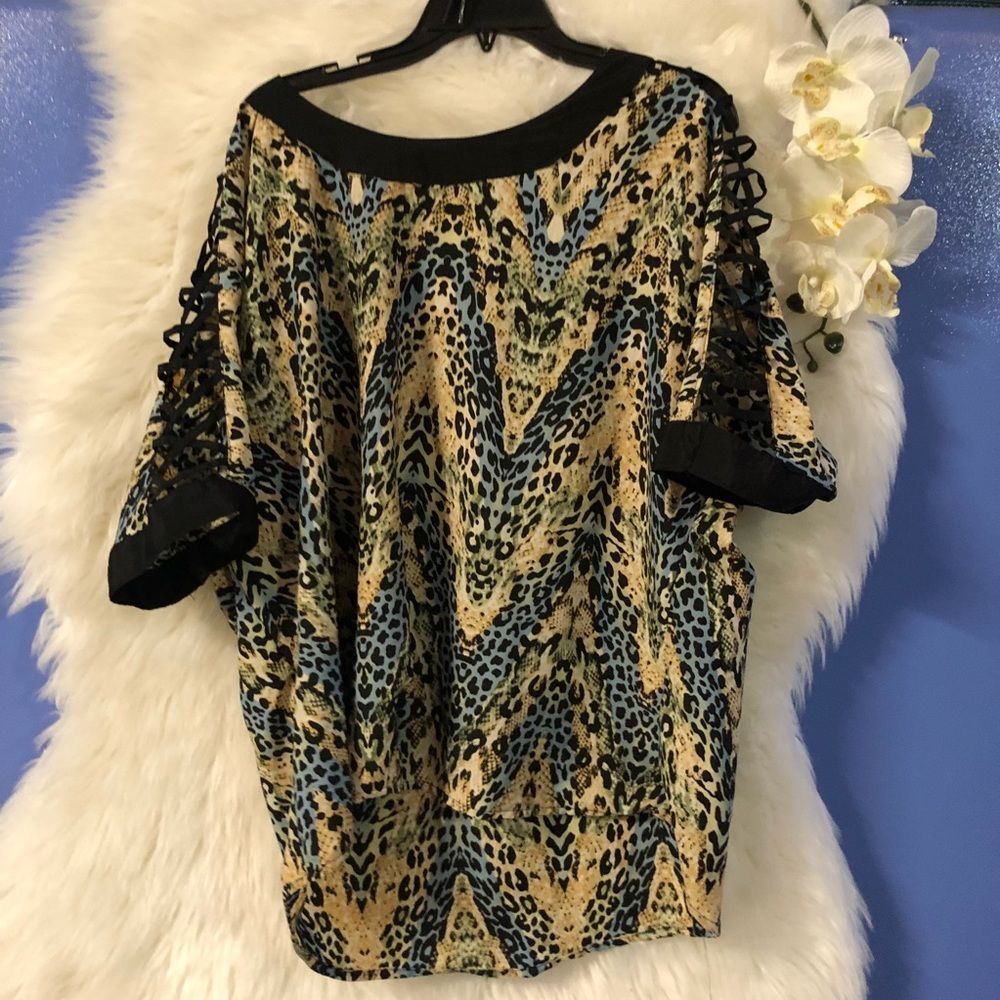 Plus size print top with cross cross lace like